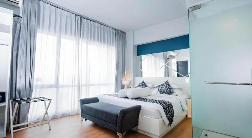 Bed in Grand Darmo Suite by AMITHYA