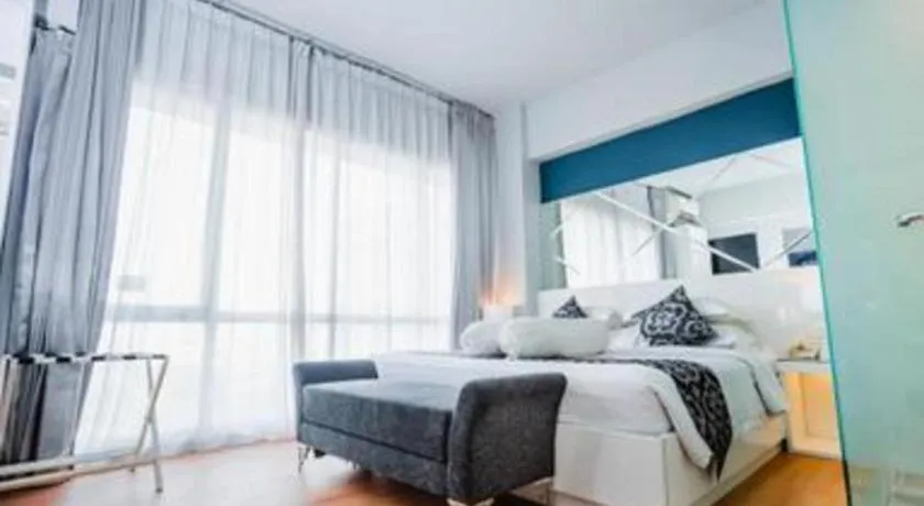 Bed in Grand Darmo Suite by AMITHYA