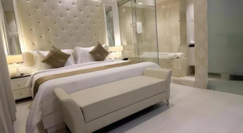 Bed in Grand Darmo Suite by AMITHYA