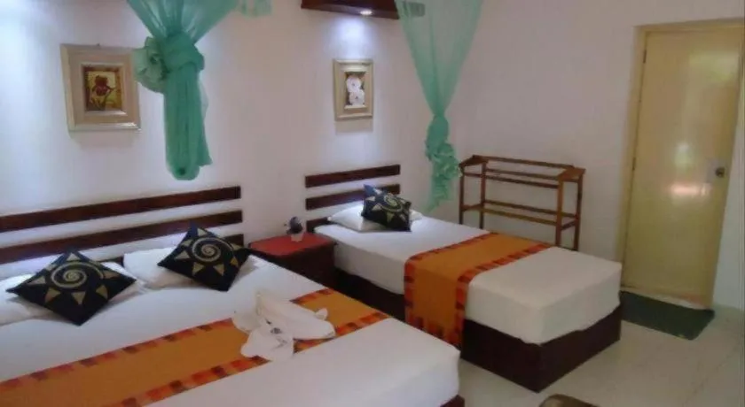 Bed in Seven Flowers Hotel