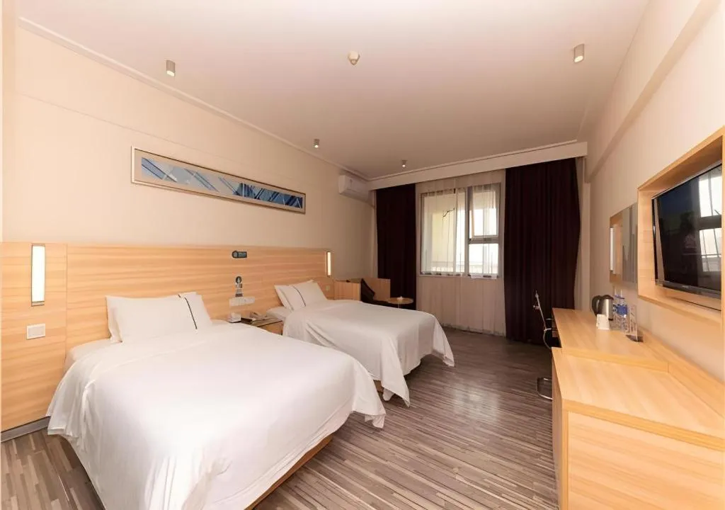 Bed in City Comfort Inn Yongzhou Jinshuiwan