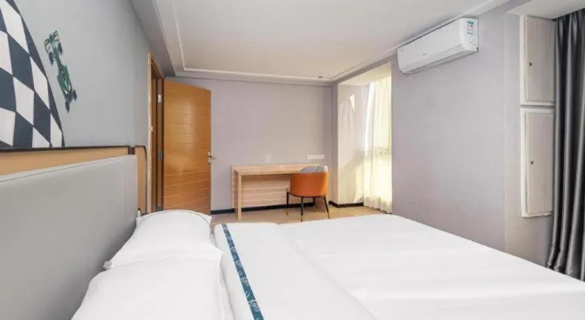Bed in City Comfort Inn Yongzhou Jinshuiwan