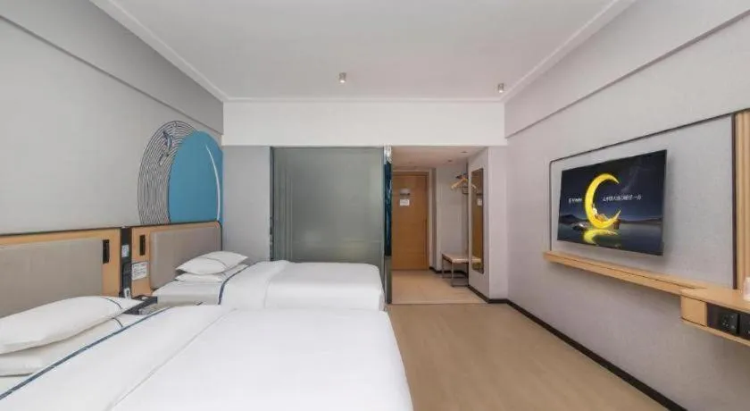 Bed in City Comfort Inn Yongzhou Jinshuiwan