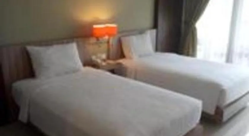 Bed in The Oxalis Regency Hotel