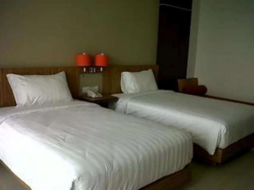 Bed in The Oxalis Regency Hotel