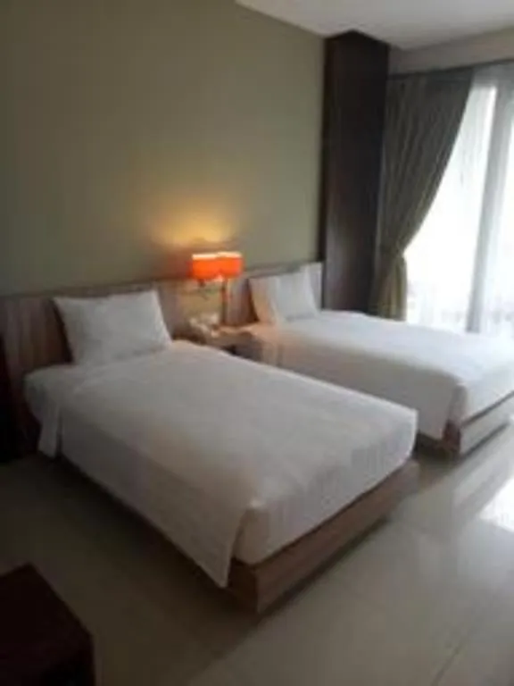 Bed in The Oxalis Regency Hotel