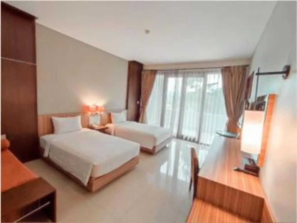 Bed in The Oxalis Regency Hotel