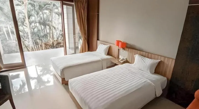 Bed in The Oxalis Regency Hotel