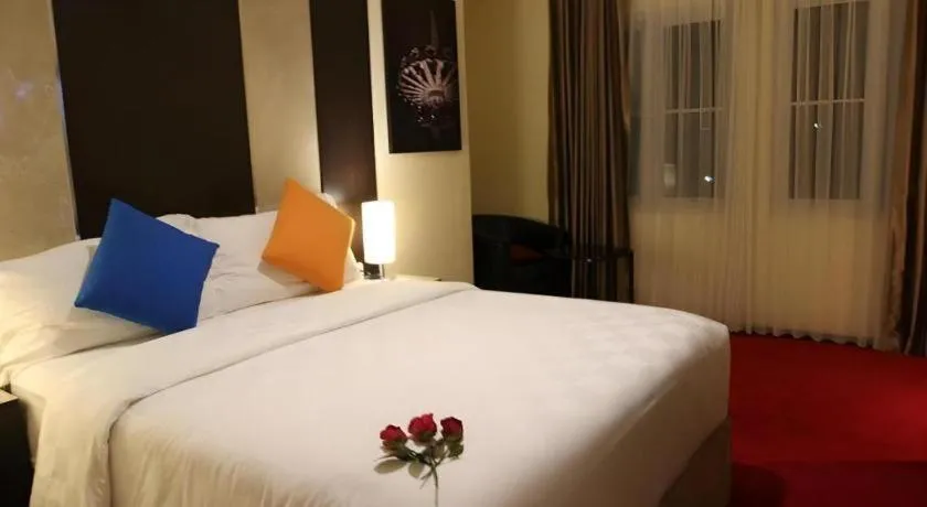 Bed in Sunbreeze Hotel