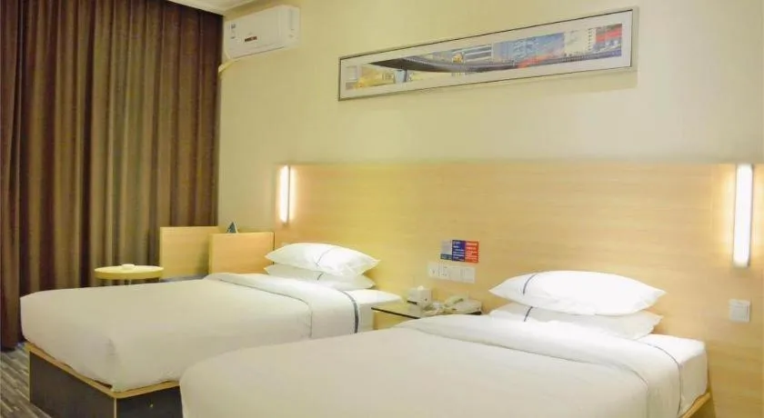Bed in City Comfort Inn Yichang Gezhouba CBD Shopping Center