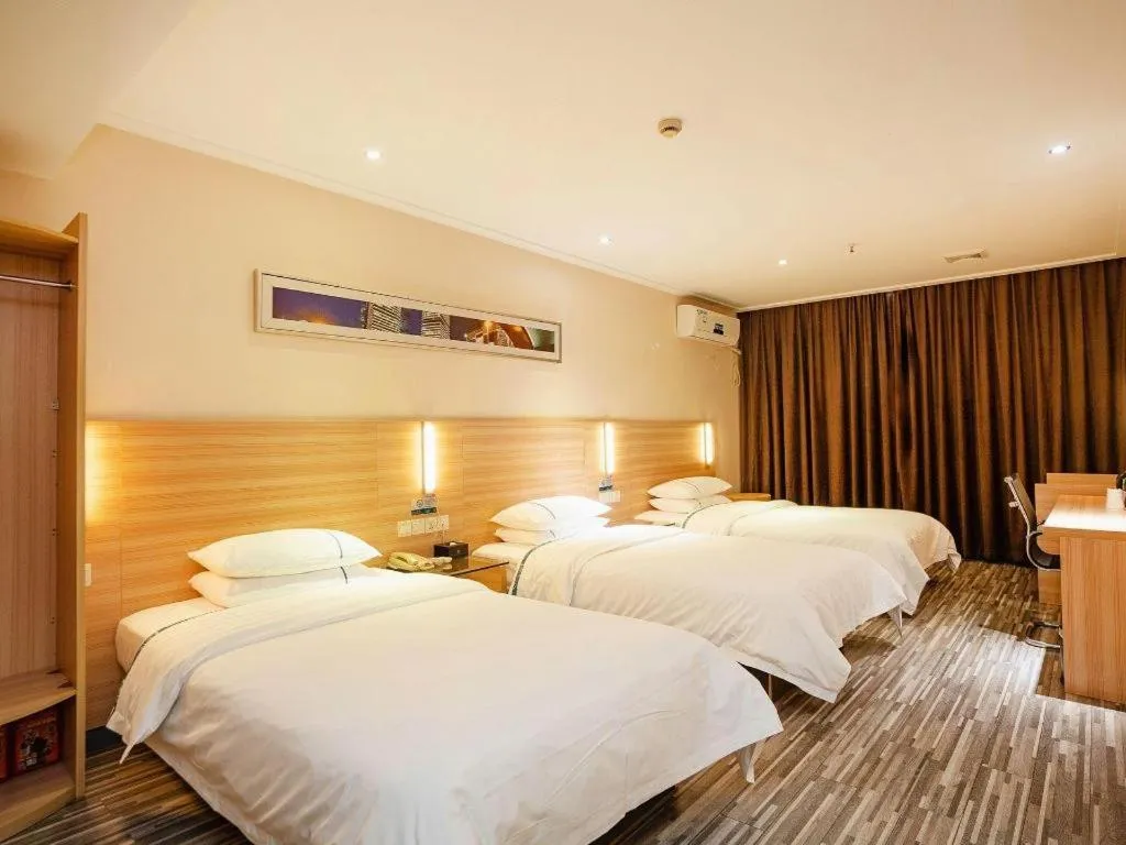 Bed in City Comfort Inn Yichang Gezhouba CBD Shopping Center