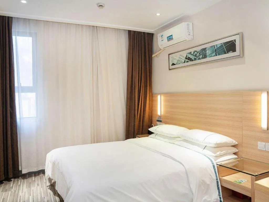 Bed in City Comfort Inn Yichang Gezhouba CBD Shopping Center