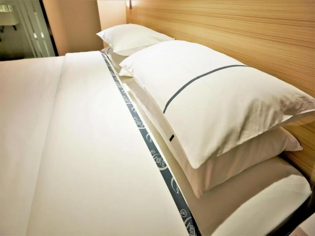 Bed in City Comfort Inn Yichang Gezhouba CBD Shopping Center
