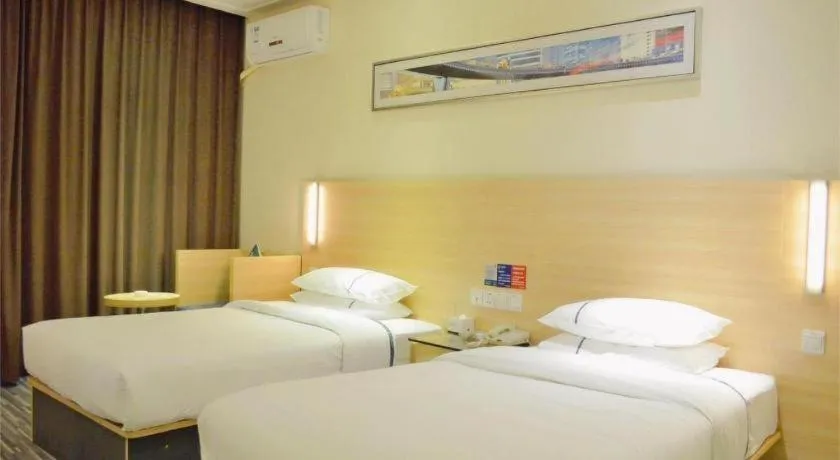 Bed in City Comfort Inn Yichang Gezhouba CBD Shopping Center