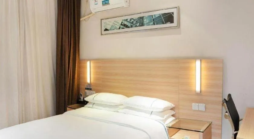 Bed in City Comfort Inn Yichang Gezhouba CBD Shopping Center