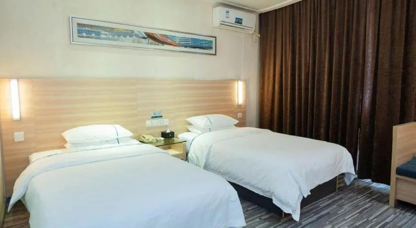 Bed in City Comfort Inn Yichang Gezhouba CBD Shopping Center