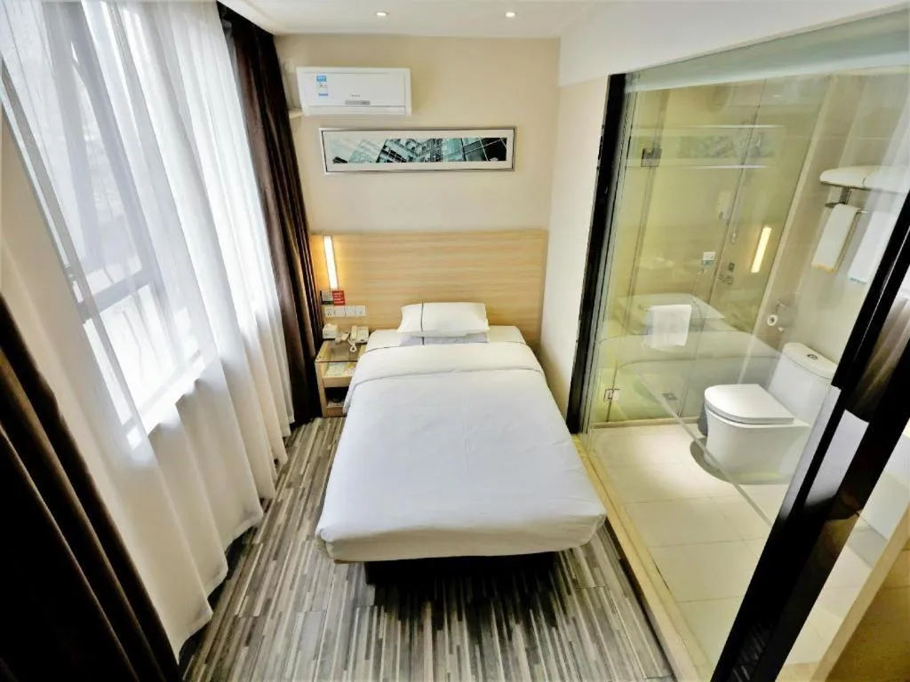 Bed in City Comfort Inn Yichang Gezhouba CBD Shopping Center