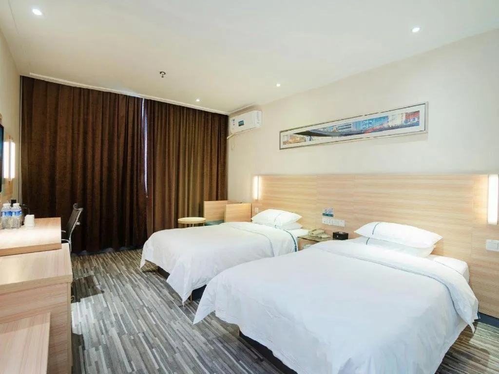 Bed in City Comfort Inn Yichang Gezhouba CBD Shopping Center