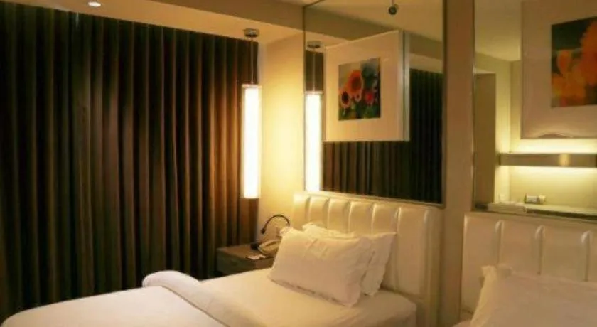 Bed in Jinjiang Metropolo Hotel - Qingdao Chengyang District Government