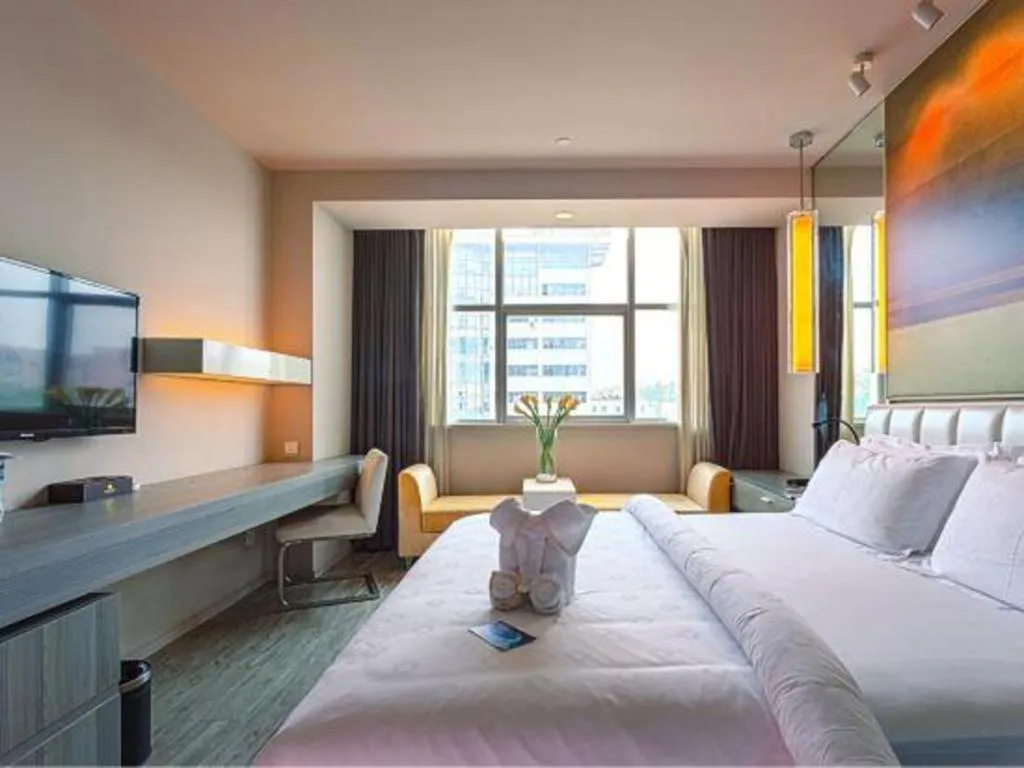 Bed in Jinjiang Metropolo Hotel - Qingdao Chengyang District Government