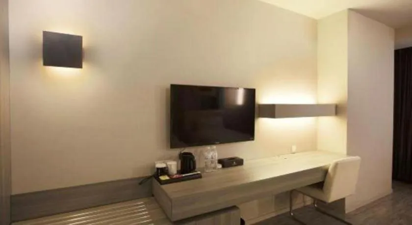 Bed in Jinjiang Metropolo Hotel - Qingdao Chengyang District Government