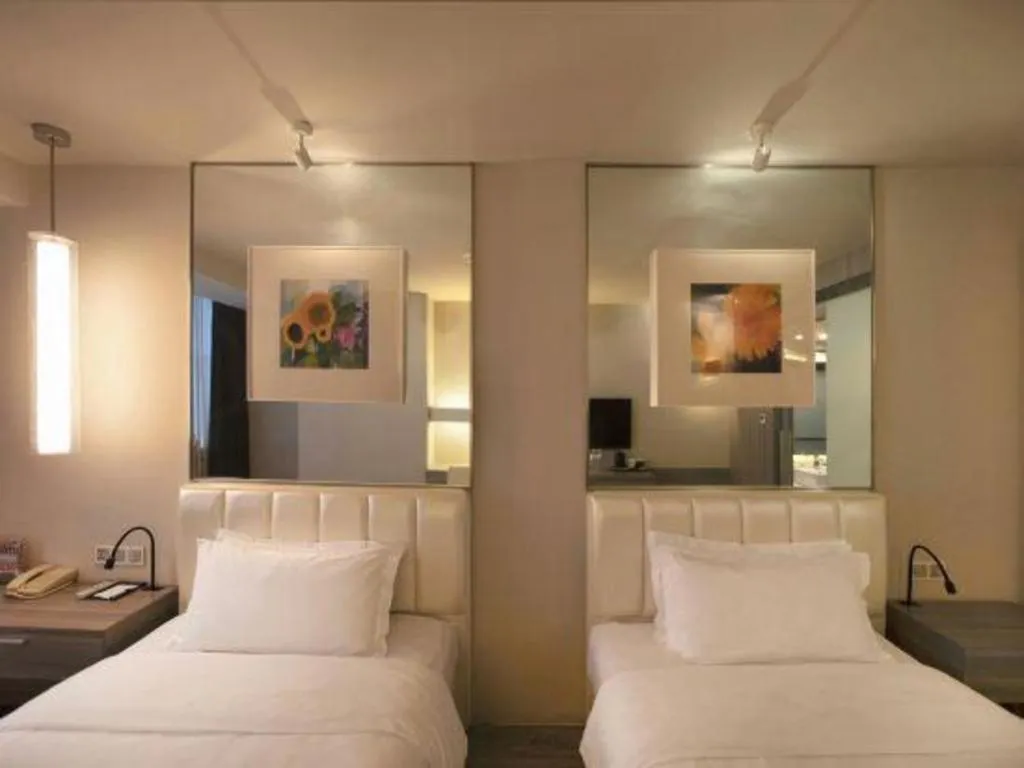 Bed in Jinjiang Metropolo Hotel - Qingdao Chengyang District Government