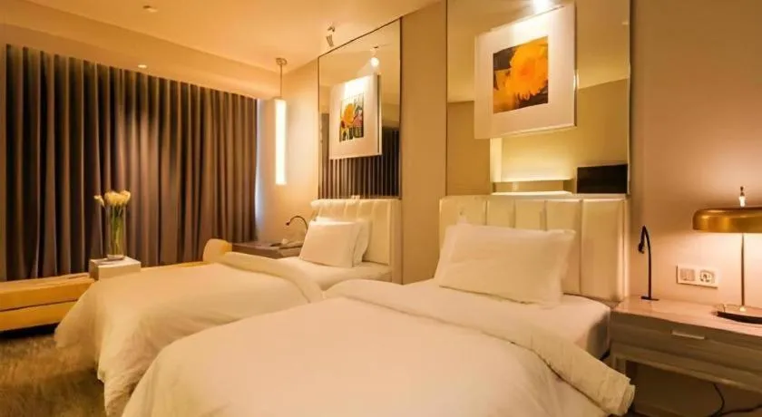 Bed in Jinjiang Metropolo Hotel - Qingdao Chengyang District Government