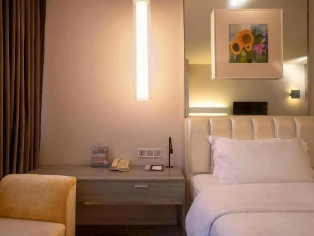 Bed in Jinjiang Metropolo Hotel - Qingdao Chengyang District Government