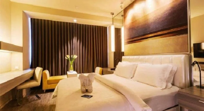 Bed in Jinjiang Metropolo Hotel - Qingdao Chengyang District Government