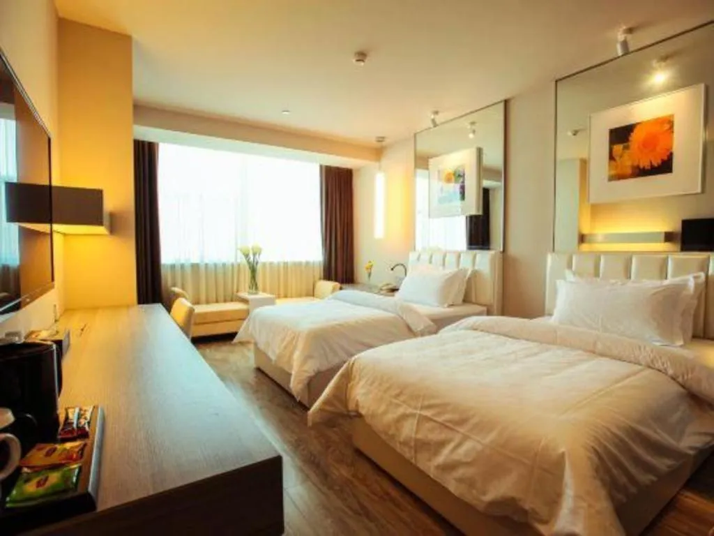 Bed in Jinjiang Metropolo Hotel - Qingdao Chengyang District Government