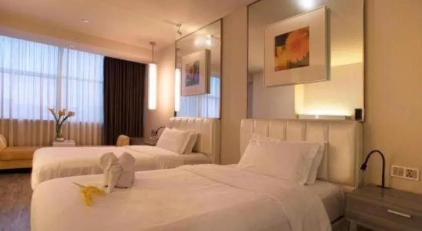 Bed in Jinjiang Metropolo Hotel - Qingdao Chengyang District Government