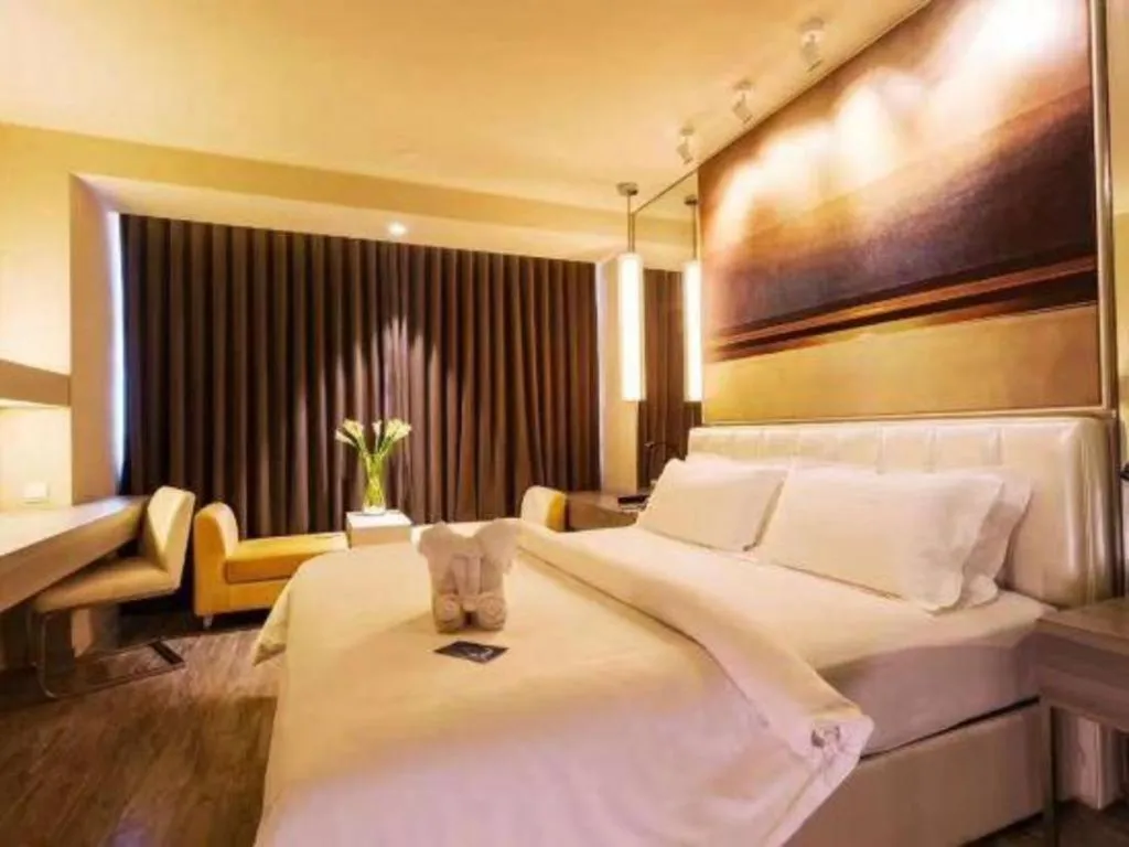 Bed in Jinjiang Metropolo Hotel - Qingdao Chengyang District Government