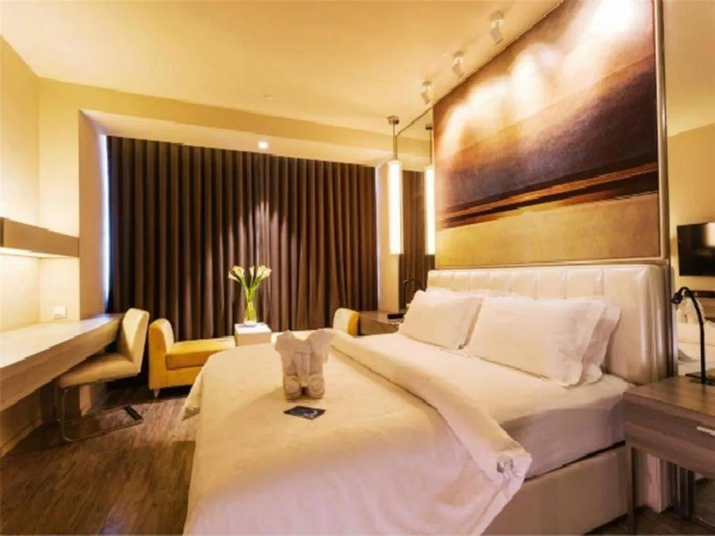 Bed in Jinjiang Metropolo Hotel - Qingdao Chengyang District Government