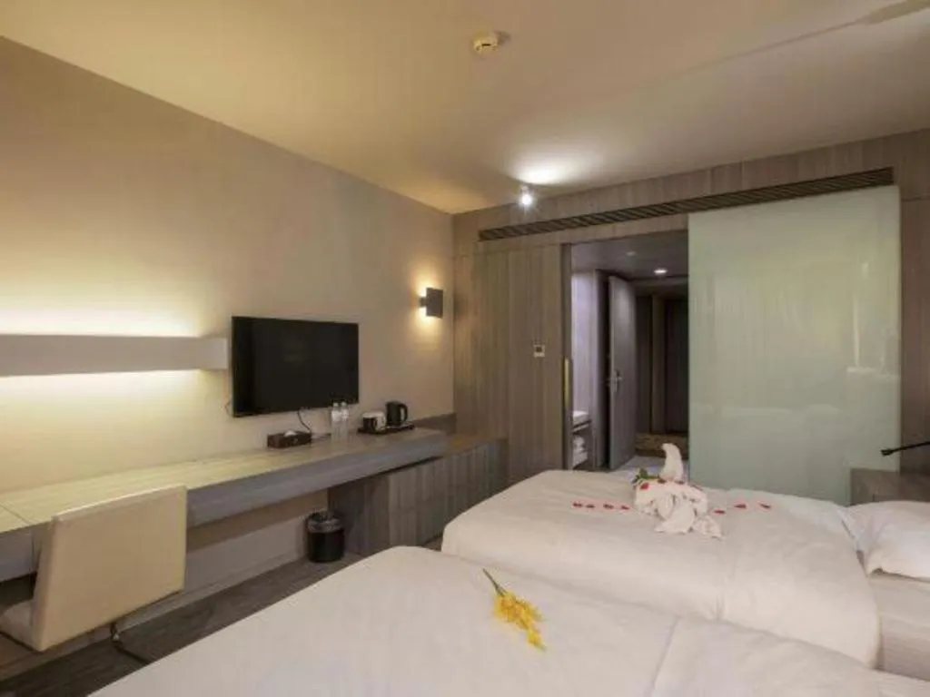 Bed in Jinjiang Metropolo Hotel - Qingdao Chengyang District Government