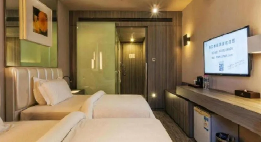 Bed in Jinjiang Metropolo Hotel - Qingdao Chengyang District Government