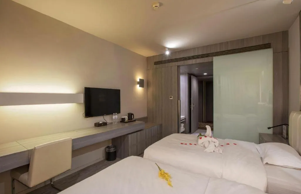 Bed in Jinjiang Metropolo Hotel - Qingdao Chengyang District Government