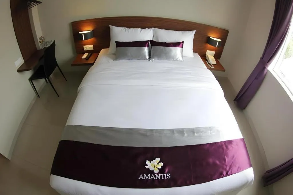 Bed in Amantis Hotel