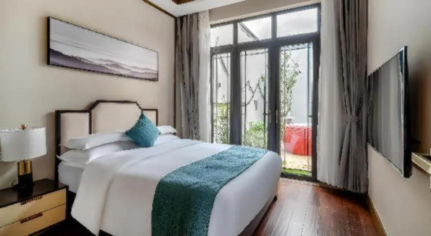 Bed in Poltton International Service Apartment Fujian Changtai Mayangxi