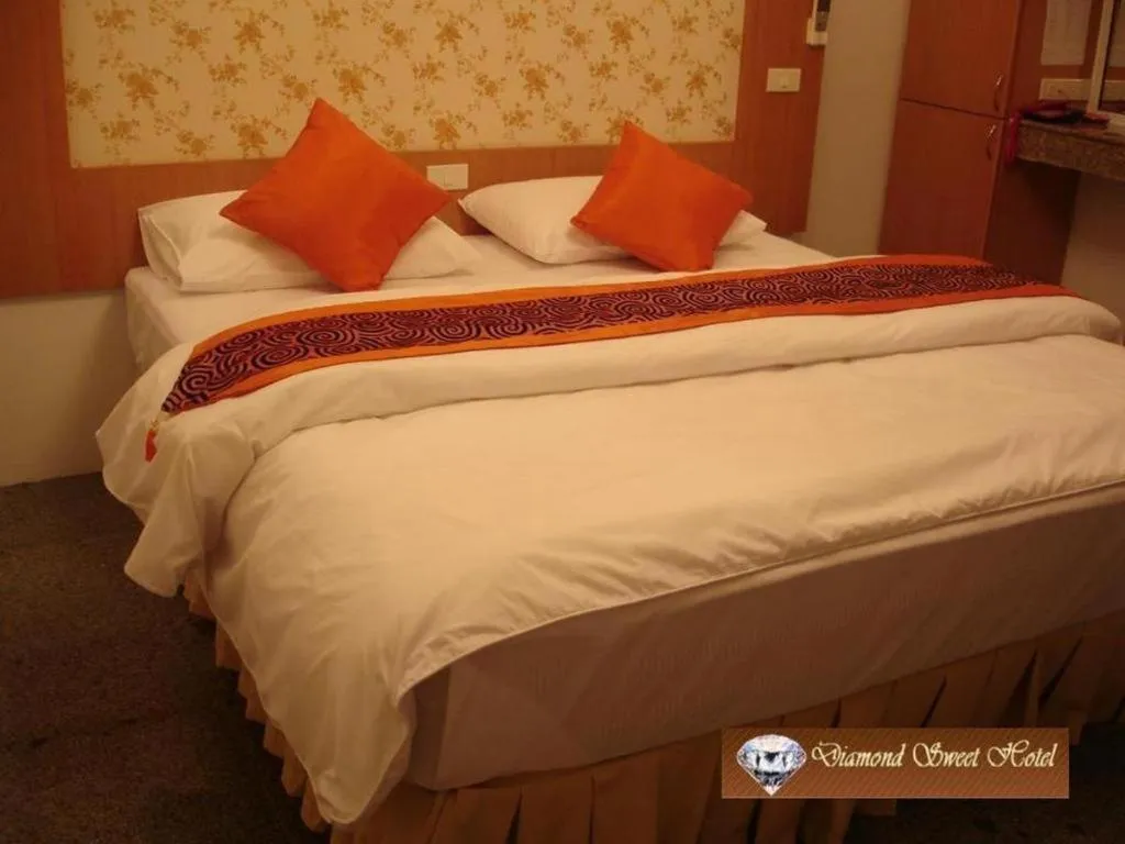 Bed in Diamond Sweet Hotel