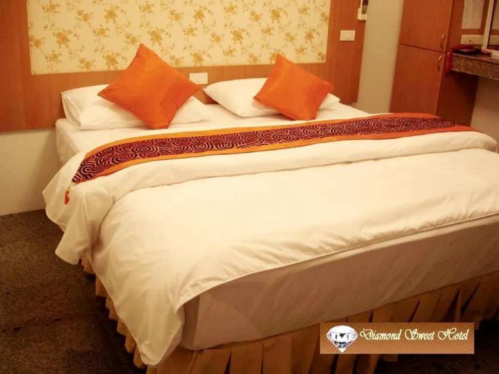 Bed in Diamond Sweet Hotel