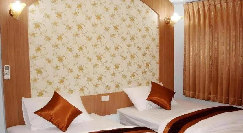 Bed in Diamond Sweet Hotel