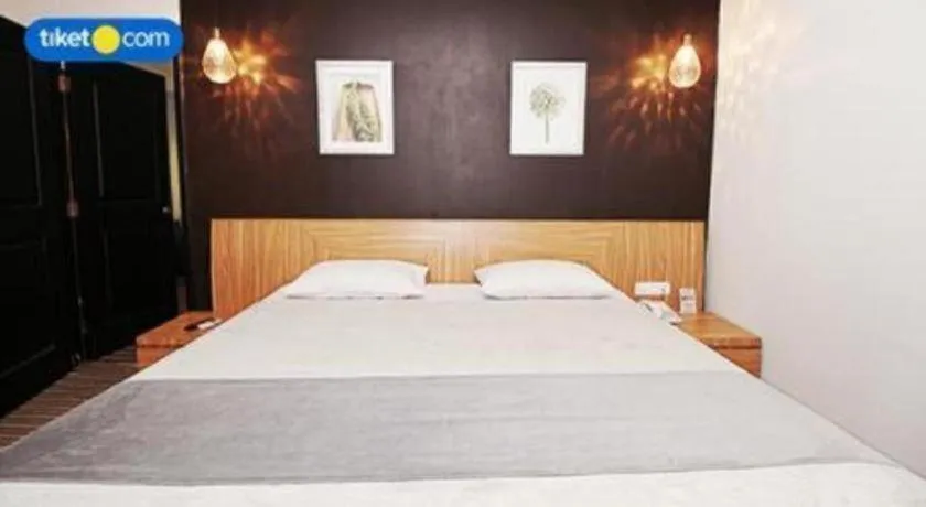 Bed in Kenari Tower Hotel