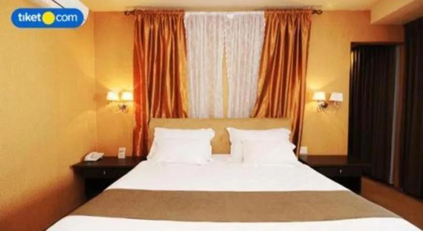 Bed in Kenari Tower Hotel