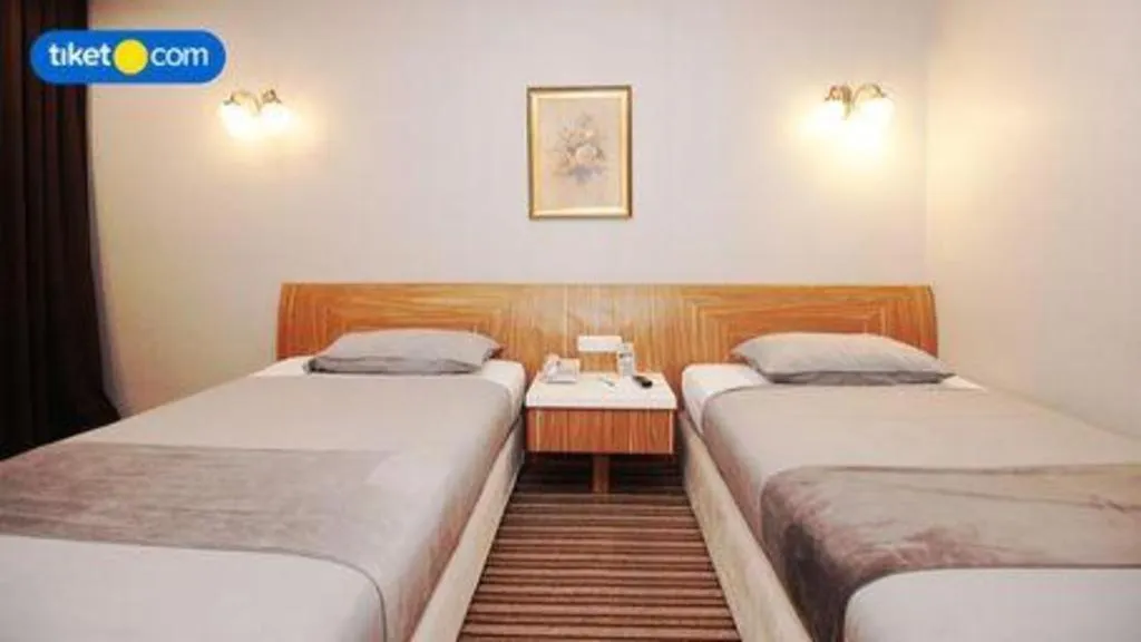 Bed in Kenari Tower Hotel