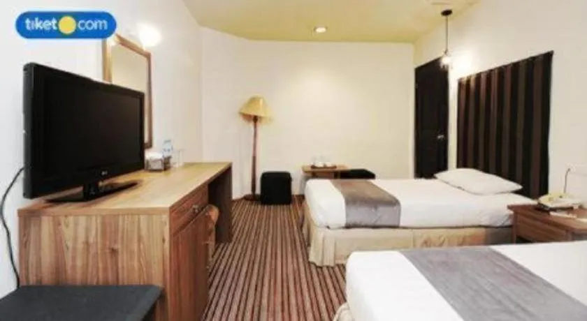 Bed in Kenari Tower Hotel