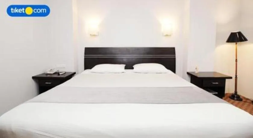 Bed in Kenari Tower Hotel