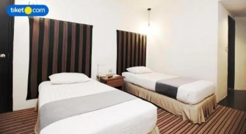 Bed in Kenari Tower Hotel