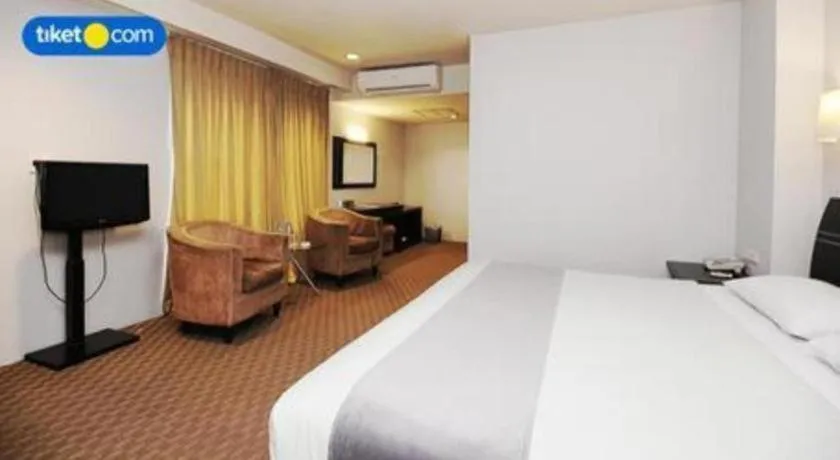 Bed in Kenari Tower Hotel