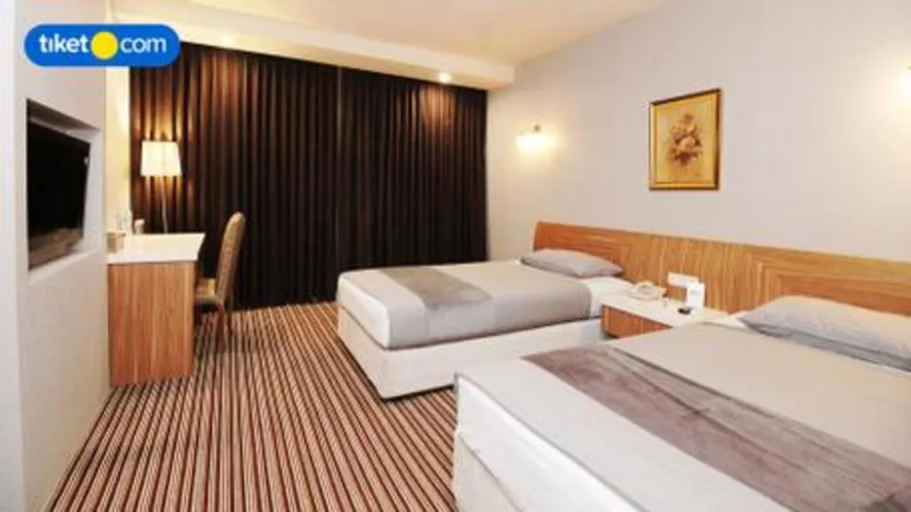 Bed in Kenari Tower Hotel