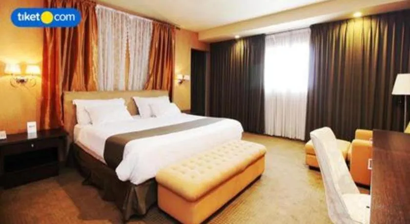 Bed in Kenari Tower Hotel